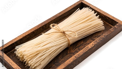 Bundled noodles in wooden tray