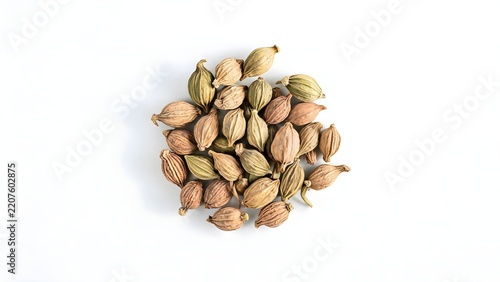 Dried cardamom pods on white background