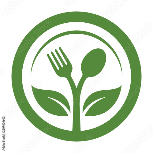 Green plant growing from plate with fork and spoon