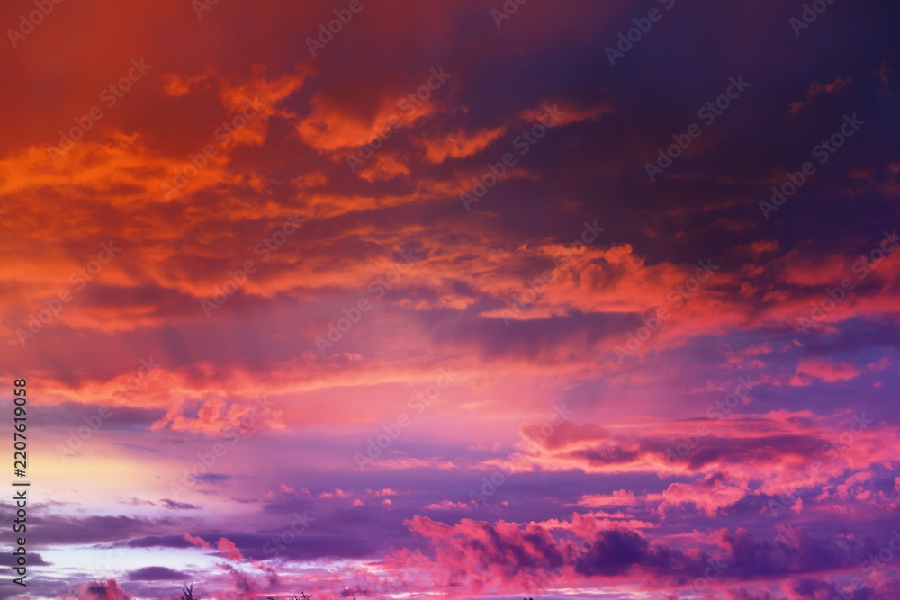 Fototapeta premium Beautiful sunset sky above clouds with dramatic light. Cabin view from airplane