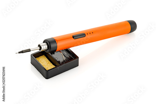 Portable electric cordless soldering iron pen with replaceable tip isolated on white background