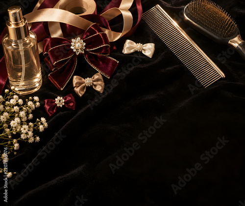 Luxury Show Dog Styling Kit with Bows and Ribbons on Velvet Background