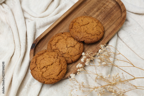 Oatmeal cookies in a tray on fabric background