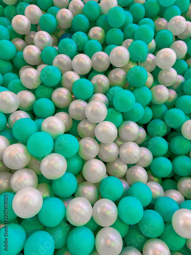 A bathtub with colorful foam balls for falling in at an entertainment center.