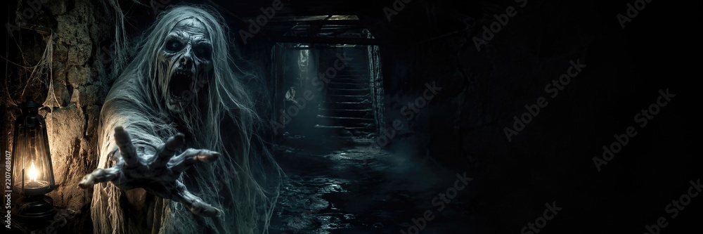 Fototapeta premium Scary ghost woman with screaming face reaching hand in dark haunted basement corridor with old lantern. Horror zombie monster in abandoned house. Banner with copy space
