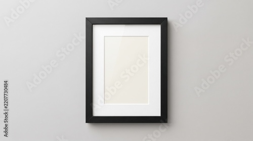 Minimalist black picture frame mockup on neutral wall, vertical poster frame with white matting, clean photo frame template for artwork display