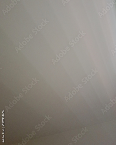 Abstract soft light gradient texture with subtle ray effect – design for minimalist presentation backgrounds, website headers, and product display backdrops.