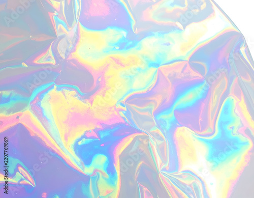 Iridescent crumpled foil texture, abstract colorful background, vibrant light reflection