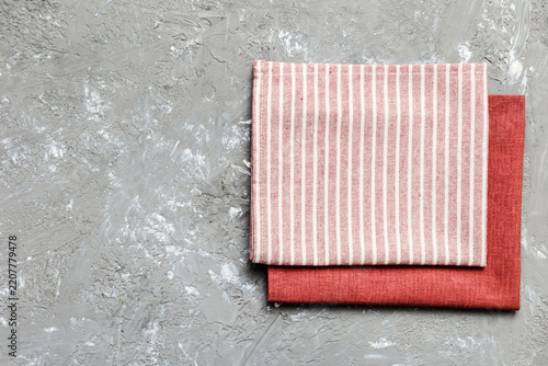 top view with red empty kitchen napkin isolated on table background. Folded cloth for mockup with copy space, Flat lay. Minimal style