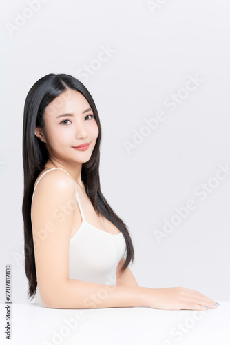Happy young Asian woman with beauty face natural makeup and healthy black hair isolated on white background, for a perfectly woman, self care, cosmetics and wellness concept.