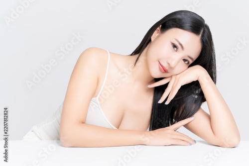 Close up of beautiful young Asian woman with healthy face and body skin, natural makeup,b body slim and black hair. for advertising beauty makeup, skincare and cosmetics concept.