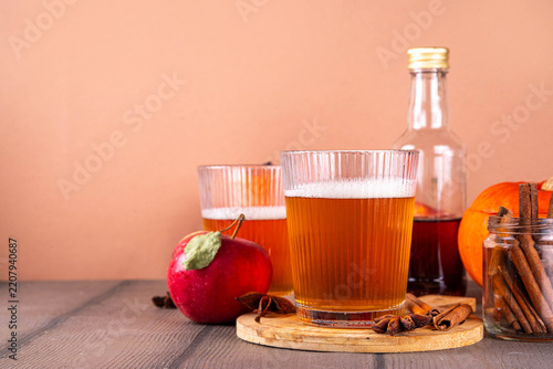 Homemade Hard Pumpkin Apple Cider with Warm Fall Spices, Tasty Alcohol or non-alcoholic cocktail for fall seasonal party, fruit beer drink 