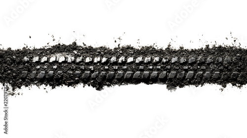 A heavy smudged black rubber tire track mark on ground