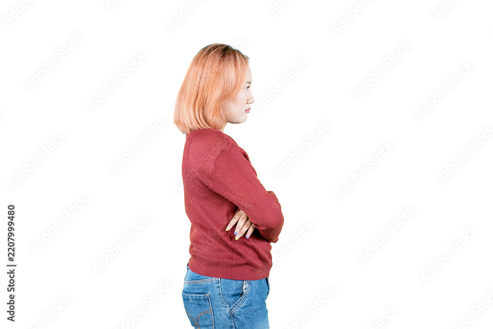 Obraz premium Side Profile View of Young Asian Woman Standing with Arms Crossed