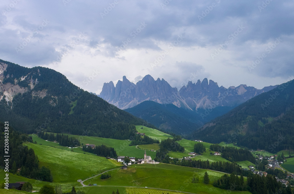 Obraz premium Landscape village Santa Maddalena in mountain valley at sunset in Dolomites, Italy. St. Magdalena and mountains. Val di Funes 