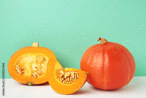 Sliced Hokkaido pumpkin on mint background.