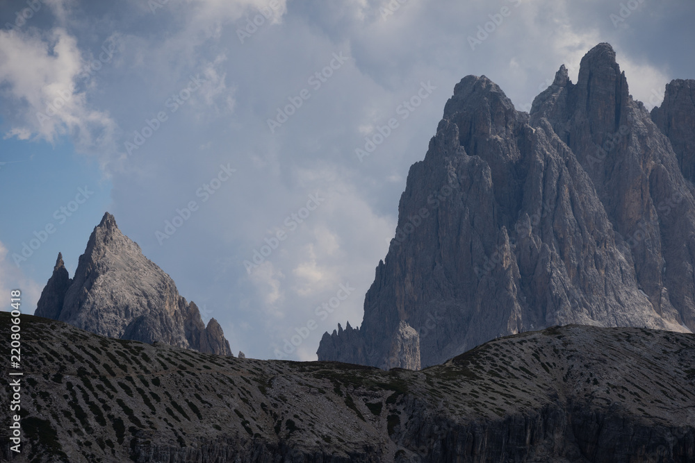 Obraz premium Mountain landscape panorama Tre Cime Mount against a blue summer background. 