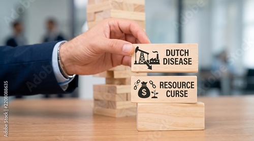 A business person places a wooden block with dutch disease and resource curse text on a tower stack
