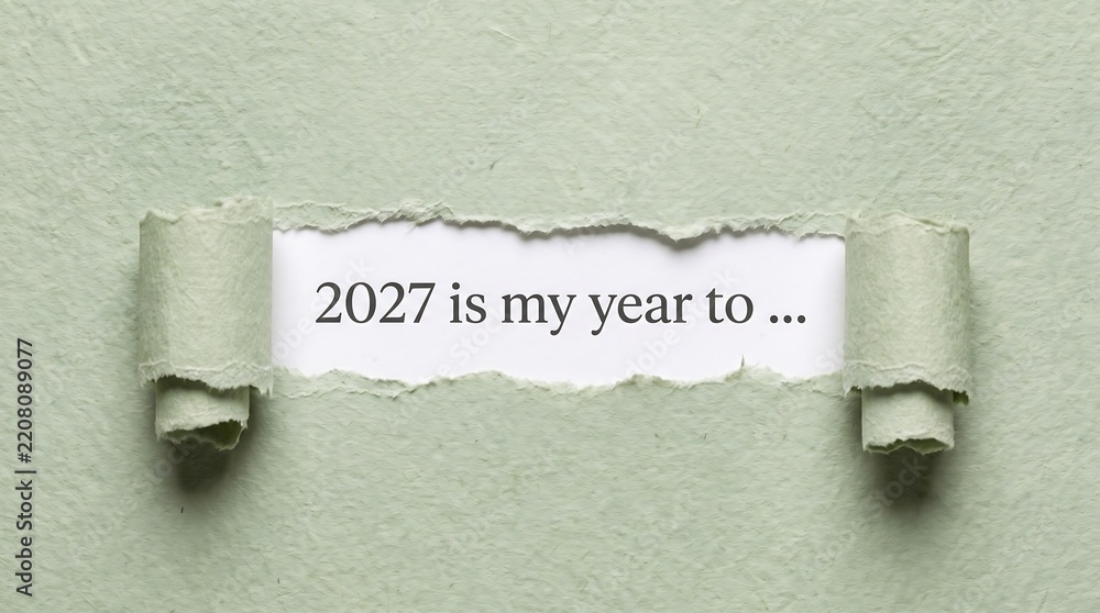 Fototapeta premium Torn green paper revealing the text 2027 is my year to, new year goals, resolutions and motivation concept for planning, personal growth, success and a fresh start in the new year