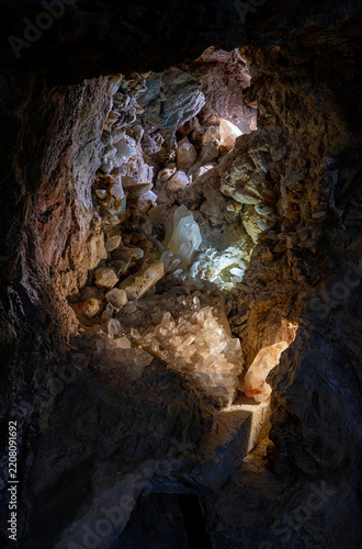 Illuminated mountain crevice with rock crystals in Austria