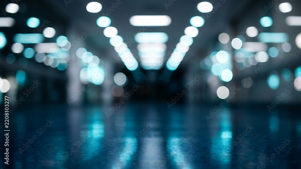 Fototapeta premium Abstract blurred futuristic corridor with glowing blue bokeh lights