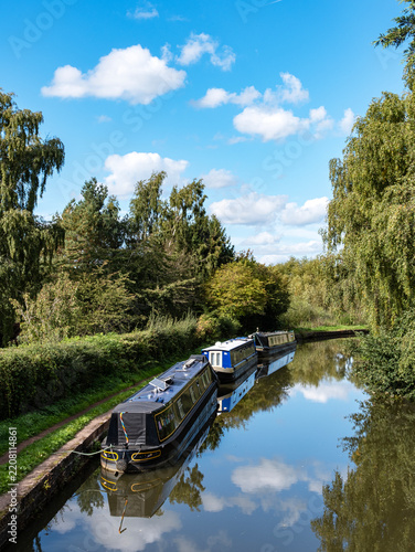 Moored narrow boats in the countryside