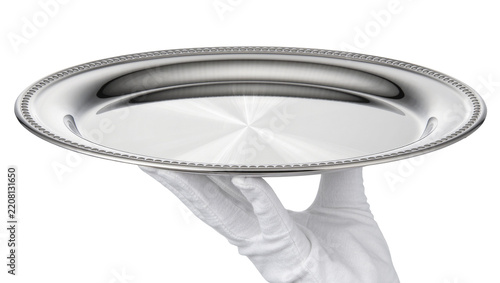 Fotografie Polished silver oval serving tray with beaded rim, held by white gloved hand iso