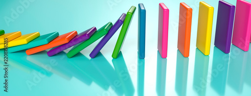 Colorful dominoes falling in a row on a bright cyan surface with soft reflections and shadows