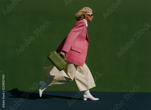 Woman Walking in Bold Pink Modern Fashion