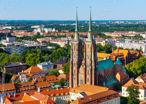 Panoramic aerial view of Saint John Baptist Cathedral on Ostrow Tumski Cathedral Island at Odra River within historic old town district of Wroclaw in Poland