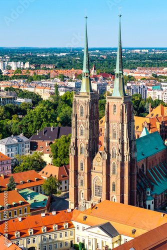 Panoramic aerial view of Saint John Baptist Cathedral on Ostrow Tumski Cathedral Island at Odra River within historic old town district of Wroclaw in Poland