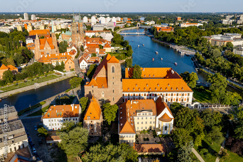 Panoramic aerial view of historic old town Ostrow Tumski district at Odra river with Holy Mary on Sands church on Piasek Island of Wroclaw in Poland