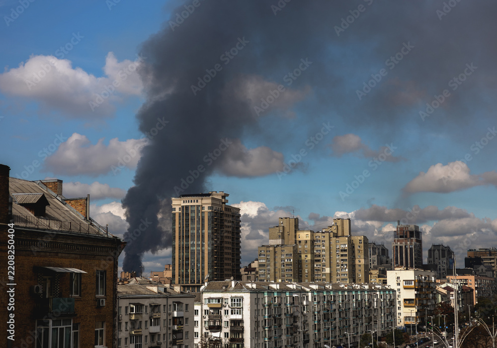 Obraz premium Fire and Thick Smoke in a Residential Area After a Russian Drone Strike in Ukraine