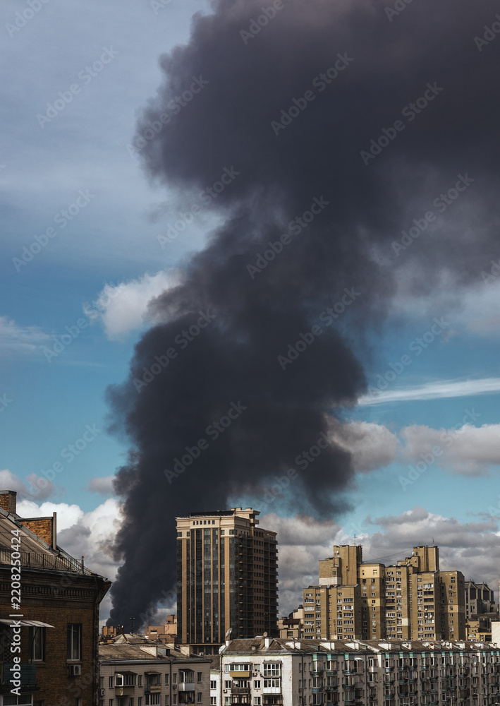 Obraz premium Fire and Thick Smoke in a Residential Area After a Russian Drone Strike in Ukraine
