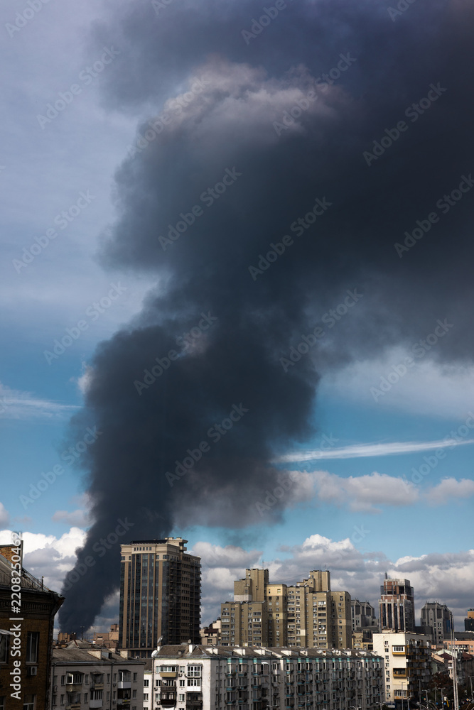 Obraz premium Fire and Thick Smoke in a Residential Area After a Russian Drone Strike in Ukraine