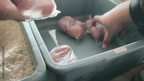 Hand Selecting Eggs from a Market Egg Tray
