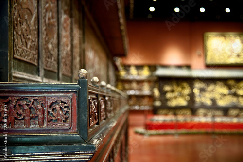 Antique Carved Wooden Railing with Figures in Museum Exhibit