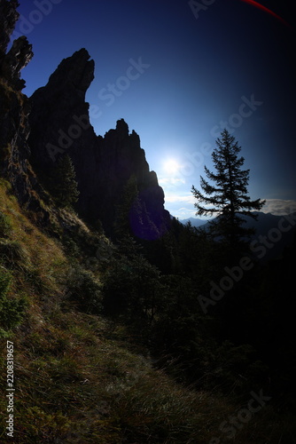 Sunny summer view of Mnichy Chochołowskie rock formations and Skorusi Źleb gully in Chochołowska Valley, Tatra Mountains