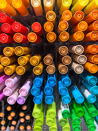 Vibrant colors on display in a craft store aisle full of markers