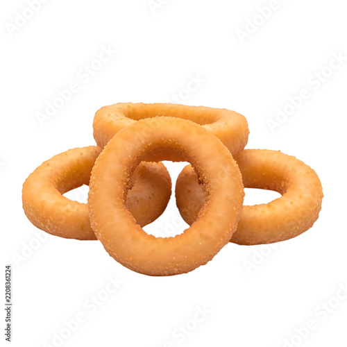 A stack of golden crispy fried onion rings on white background