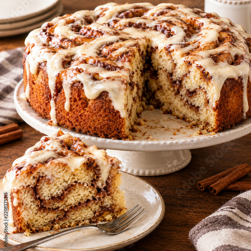 A cinnamon bun cake on a table during autumn