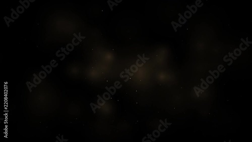 Golden dust particles floating in dark background, bokeh light overlay
