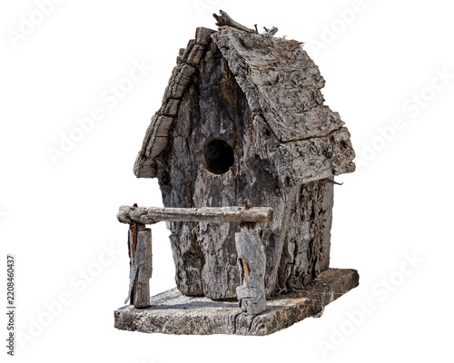 Small rustic wooden bird house with a perch