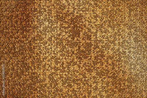 Gold metal texture featuring hammered copper surface for luxury interior design and artistic