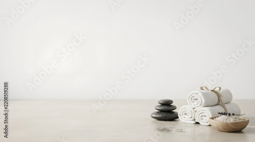 a white vase sitting on top of a table