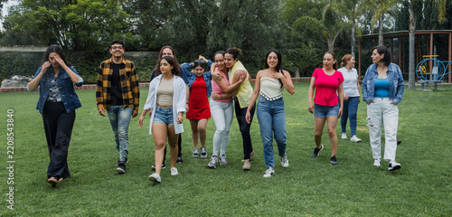 group of latin people having fun outdoors in Mexico Latin America, large and diverse group of hispanic people of different ages, multi age and inclusive concept