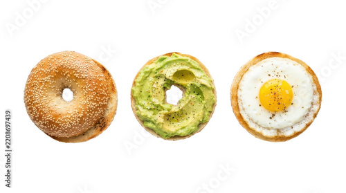 Top view of a sesame bagel sandwich components including the top bun, mashed avocado spread, and a fried sunnysideup egg, isolated on transparent background