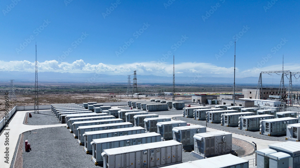 Obraz premium rows of outdoor energy storage battery containers under blue sky
