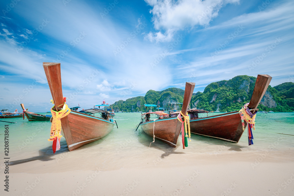 Fototapeta premium Natural scenery of long-tail boats on the beach of Phi Phi Don, Krabi, Thailand