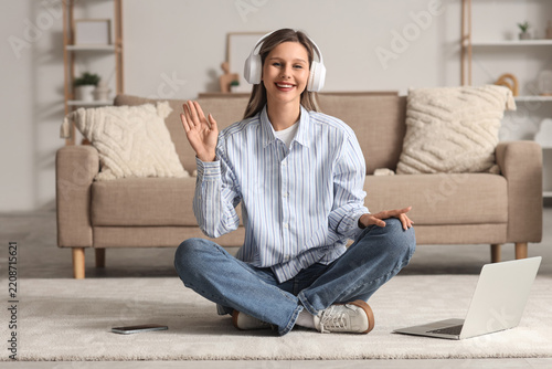 Remote work and video call communication, happy woman waving hello during onl...